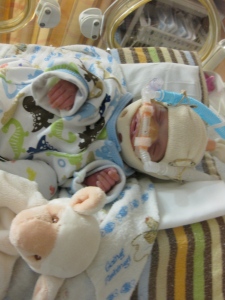 In the outfit our friends sent while I was on hospital bedrest. Look at how big that preemie outfit is on him!